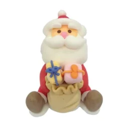 Décor comestible Père Noël assis cadeau
