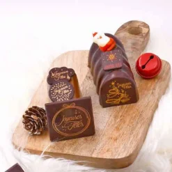 Embouts bûchettes chocolat Joyeuses Fêtes (x56)